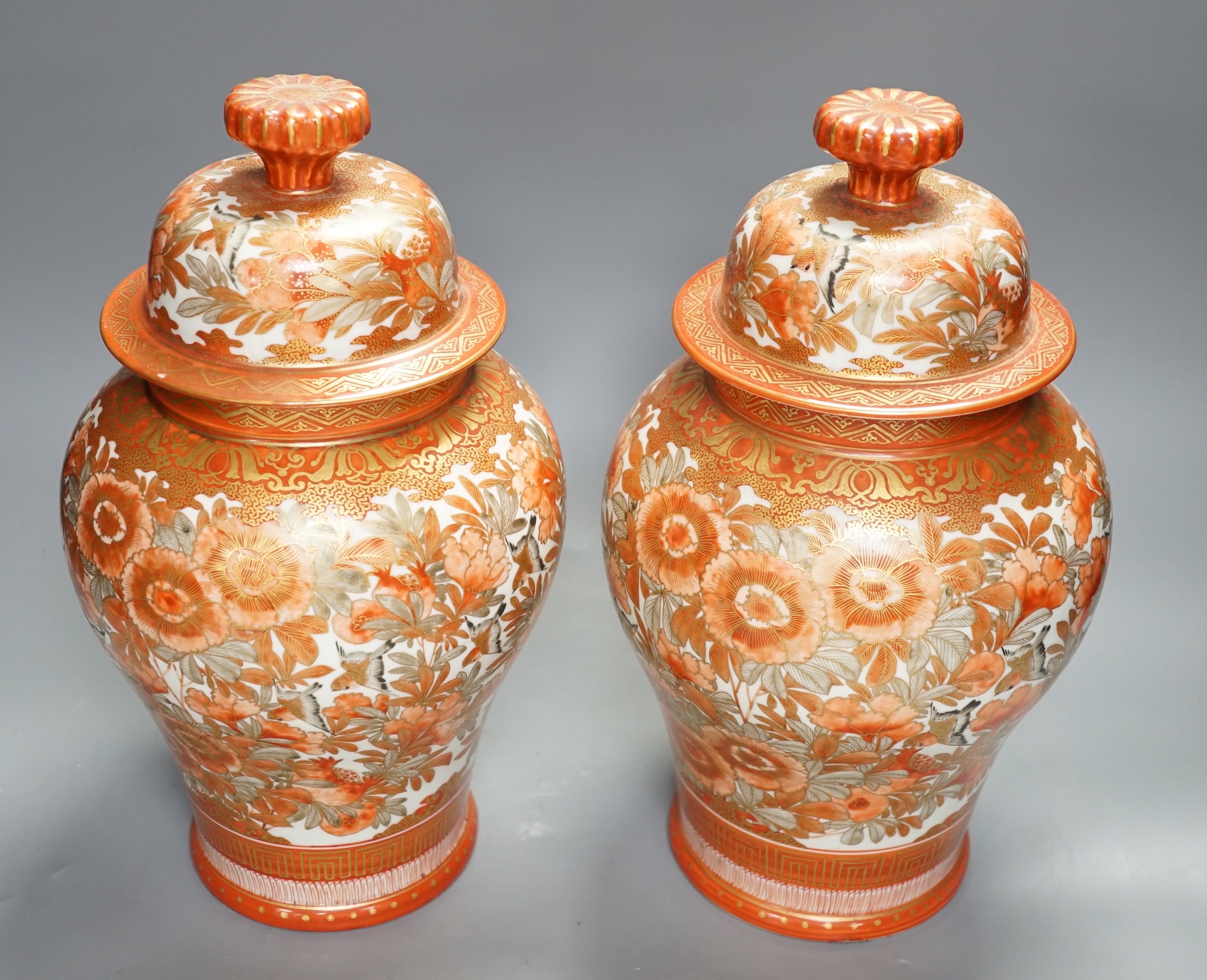 A pair of 19th century Kutani lidded ovoid shaped vases. 33cm high